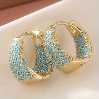 Elegantes aros de oro con perlas turquesas